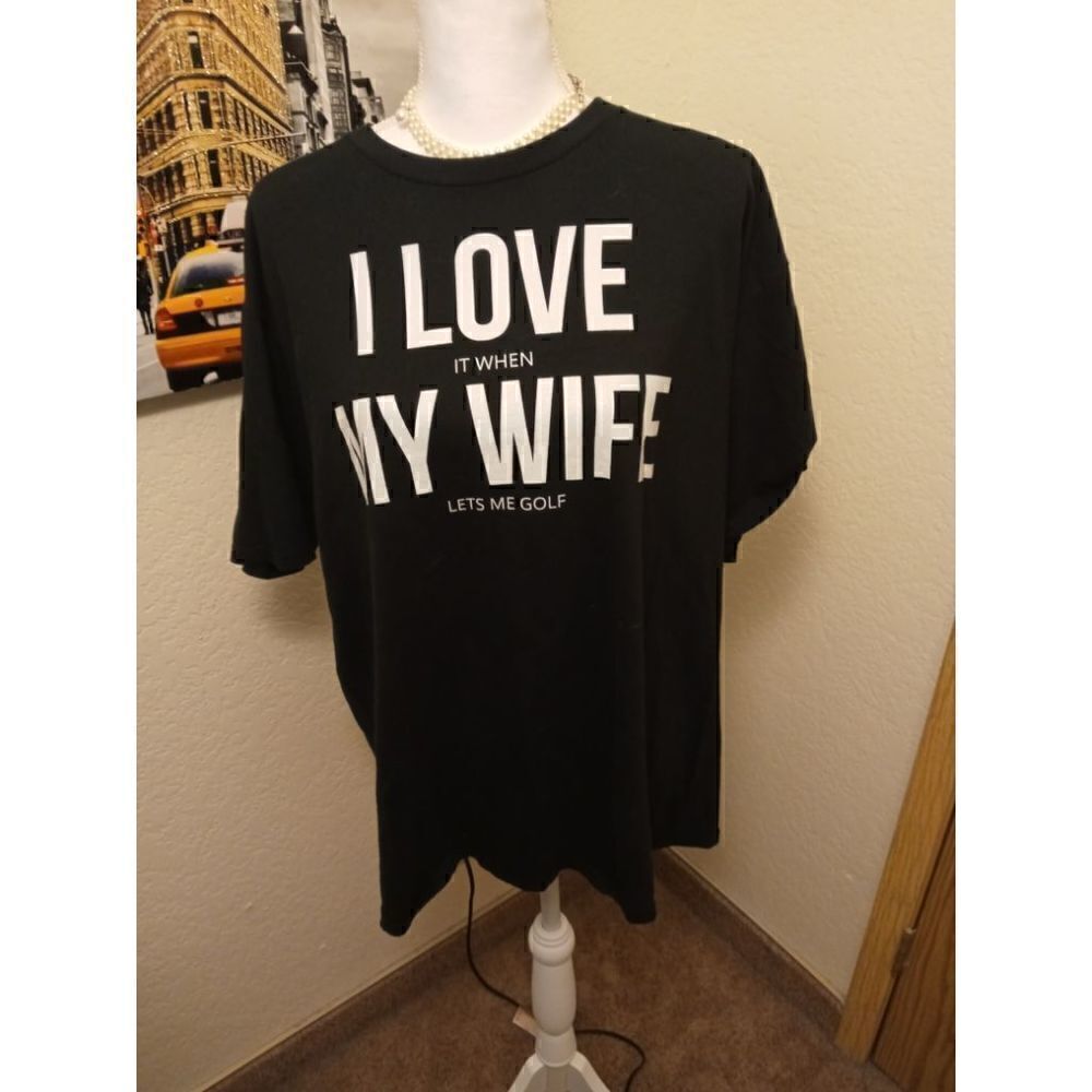 "I Love it When My Wife Lets Me Golf" Black T Shirt 
Port & Company Size XL.
